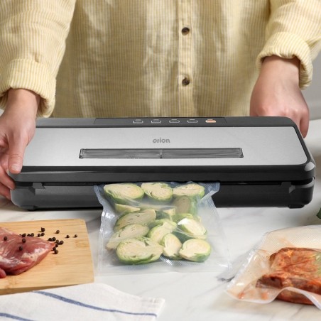 Vooliku ja fooliumiga toidu vaakumpakendaja